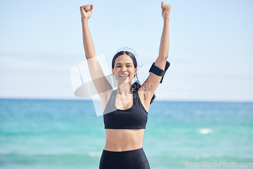 Image of Happy woman, fitness and achievement on beach for winning, workout success or outdoor exercise. Portrait of excited female person in celebration for accomplishment, milestone or training by the ocean