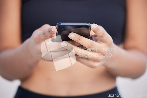 Image of Woman, phone and hands typing for fitness communication, social media or outdoor networking. Closeup of female person chatting or texting on mobile smartphone app for online browsing or research