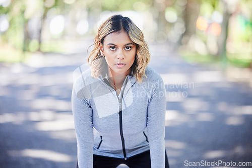 Image of Runner woman, portrait and ready in park, mindset and exercise for fitness training in nature. Indian girl, commitment and pride for wellness, health or outdoor workout for body, self care and goals