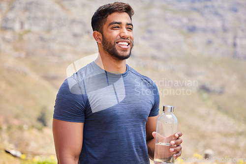 Image of Thinking, runner or happy man drinking water in nature to hydrate, relax or healthy energy on exercise break. Tired, smile or thirsty athlete refreshing with liquid bottle in training or workout