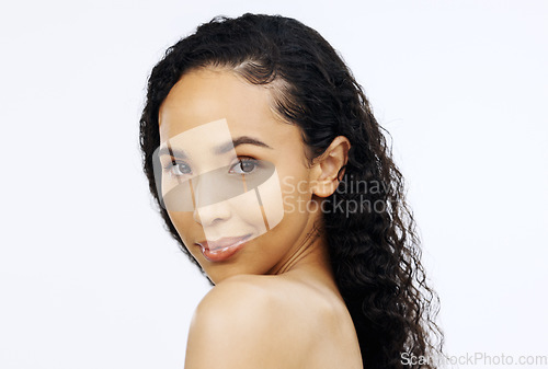 Image of Black woman, over shoulder face and beauty with smirk and flirt, playful and skincare with cosmetics isolated on white background. Cosmetic care, dermatology and facial with healthy skin, female mode