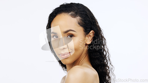 Image of Black woman, over shoulder face and beauty with smirk and sensual flirt, playful and skincare with cosmetics isolated on white background. Cosmetic care, dermatology and facial with healthy skin, fem