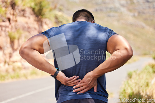 Image of Sports man, runner and back pain from fitness training injury or running workout accident outdoors. Active person, hurt spine muscle or injured male athlete with exercise emergency on road