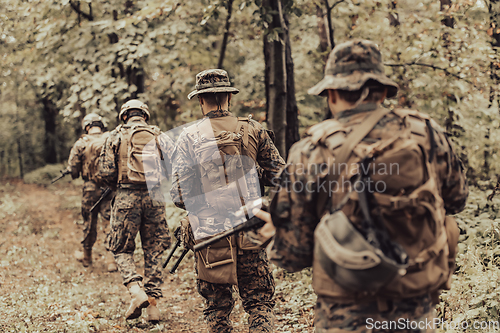 Image of Modern warfare Soldiers Squad Running as Team in Battle Formation