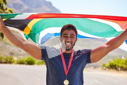 Image of Runner, success and portrait of happy man with flag on road for fitness goal, winning or running race. Sports champion, winner or proud South African or excited athlete with victory or gold medal