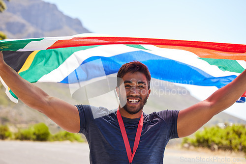 Image of Runner, winner and portrait of happy man with flag on road for fitness goal, winning or running race. Sports champion, proud South African or excited athlete with competition victory or success