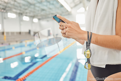 Image of Hands, phone and athlete at swimming pool with social media, scrolling online or browsing internet after exercise. Swim, sports and woman with cellphone for communication after workout or training