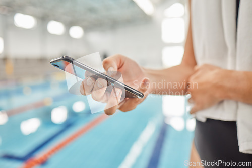 Image of Phone, hands and athlete at swimming pool with social media, scrolling online or browsing internet after exercise. Swim, sports and person with cellphone for communication after workout or training