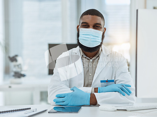 Image of Portrait, desk and black man or doctor with face mask for covid, virus or sick at hospital. Expert, office and African nurse or surgeon at a table or workspace for medical, healthcare or clinic job