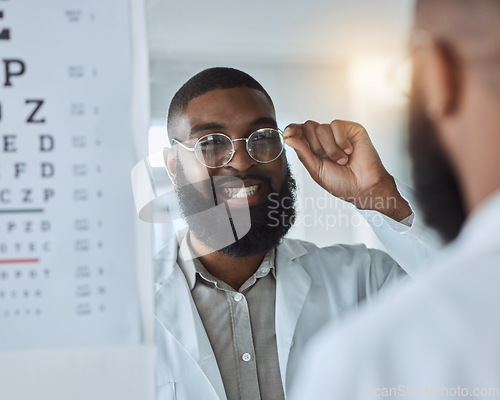 Image of Eye exam, smile and optometrist or man with glasses, confidence and happy service in consultation office. Ophthalmology, face in mirror and expert in vision, test or assessment for eyes or health