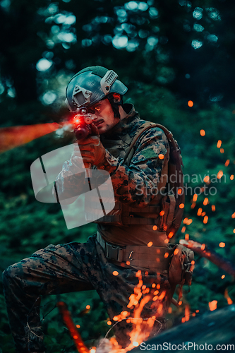 Image of A soldier fights in a warforest area surrounded by fire