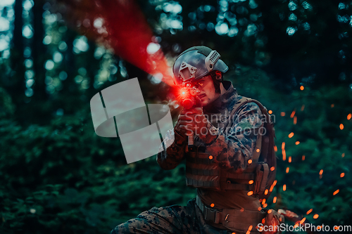 Image of A soldier fights in a warforest area surrounded by fire