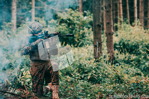 Image of A soldier fights in a warforest area surrounded by fire
