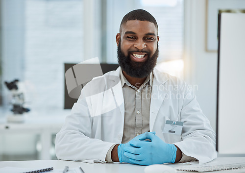 Image of Black man, portrait and scientist smile in lab for future innovation, medical research and physics investigation. Happy male laboratory worker, science expert and pharmaceutical development at desk