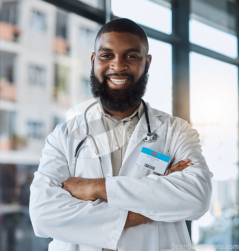 Image of Doctor, portrait and man with arms crossed for healthcare service, clinic and hospital management or support and leadership. Happy face of medical african person for professional health and proud job