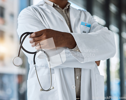 Image of Hands of person, doctor and arms crossed with stethoscope in surgery, clinic and trust in hospital. Closeup of medical worker, cardiology professional and tools for consulting of healthcare services