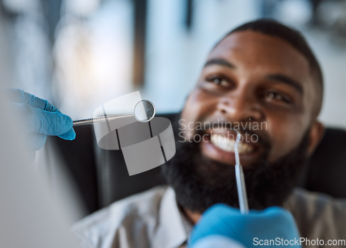 Image of Man, hands and dentist tools for cleaning in clinic for medical treatment, teeth whitening or veneer hygiene. Smile, mirror and dental excavator for African patient in mouth health checkup or consult