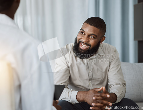 Image of Happy black man, therapist and consultation in meeting for healthcare, mental health or therapy at the hospital. African male person talking to consultant in physiology, counseling or medical help