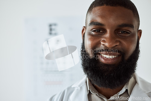 Image of Optometrist, face and portrait of man with smile with trust for eye care services, healthcare consultation and clinic assessment. Happy African optician with pride for medical analysis of eyes