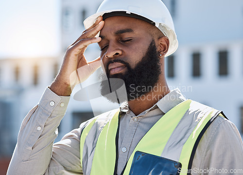 Image of Construction, man and worker with headache, stress of building renovation and civil engineering mistake. Tired face of confused African contractor in burnout, crisis and industrial problem in city