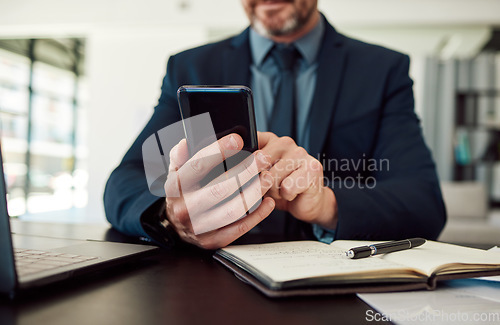 Image of Hands, phone and notebook with a business man checking his calendar while planning in an office. Mobile, communication or test message with an employee reading a schedule at his desk in the workplace