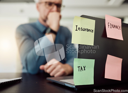 Image of Insurance, tax and finance on sticky notes with a thinking business man in an office at a desk feeling stress or anxiety. Laptop, accounting audit and an employee worried while working on a computer