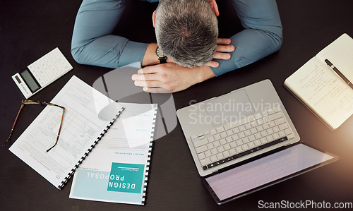 Image of Business man, sleep and desk in top view with laptop, documents and working overtime for design proposal. Web developer, notebook and computer with fatigue, tired and stress in workplace for deadline