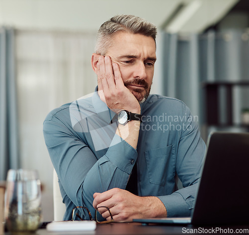 Image of Confused, bored and business man at laptop in office with stress, fatigue and problem. Computer, tired and mature manager with doubt, financial crisis and reading debt email, tax audit and burnout