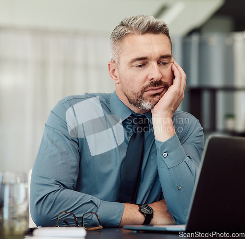 Image of Tired, bored and business man with laptop in office, stress or problem in company. Computer, sad and mature manager with challenge, fatigue and financial crisis, debt email and burnout for tax audit