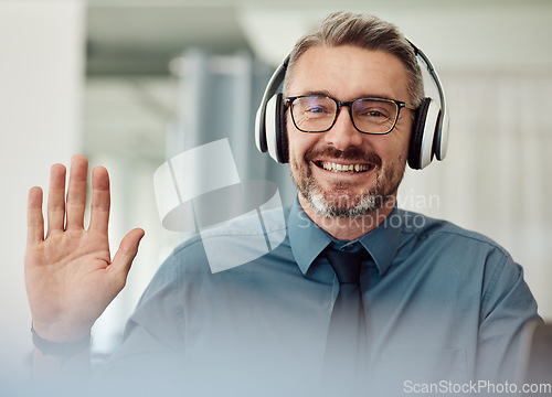 Image of Headphones, portrait and man wave on video call for business, smile or chat at home. Happy face, hello and webinar of mature manager with glasses in virtual meeting, online conference and remote work