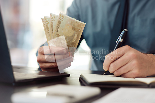 Image of Hands, money and writing in office, book and accounting for audit, balance and financial review in workplace. Man, pen and notebook with cash, bills and budget for small business, investing or saving