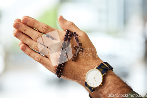 Image of Christian man, rosary and hands praying for spiritual faith, holy gospel or worship God at church. Closeup, prayer beads and cross for support of religion, culture and praise of jesus, heaven or hope