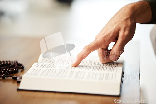 Image of Hands, christian and bible book with rosary for praying, spiritual faith and holy worship of God in heaven. Closeup of person studying religion, learning prayer and scripture story of Jesus Christ