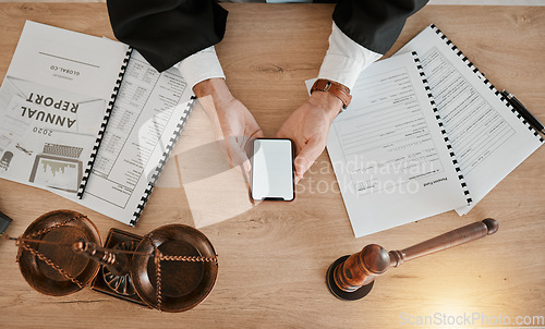 Image of Judge hands, phone and person reading attorney communication, advertising space or contact law firm consultant. Lawyer, cellphone mockup and top view advocate work on legal, contract or policy update