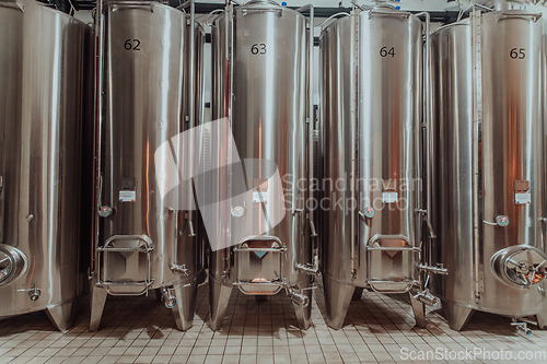 Image of Modern wine distillery and brewery with brew kettles pipes and stainless steel tanks