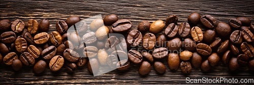 Image of Coffee beans on wooden background