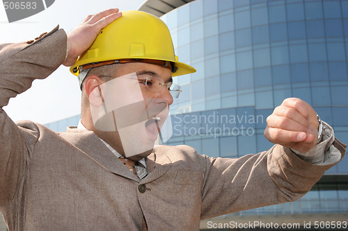 Image of businessman looking at his watch