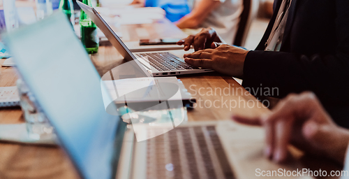 Image of Close up photo of a woman's hand using on a laptop at a seminar