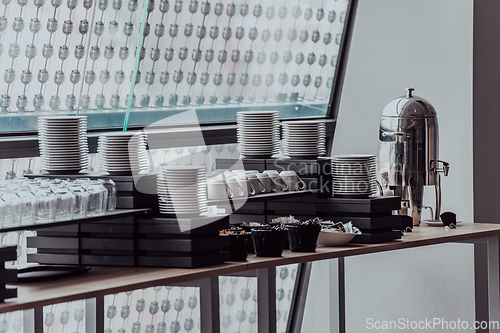 Image of A table in a modern hotel with dishes ready to serve guests