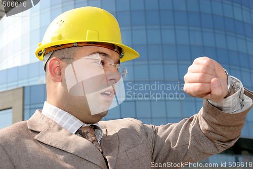 Image of businessman looking at his watch