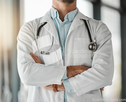 Image of Healthcare, trust and a doctor arms crossed in the hospital for a wellness appointment of checkup. Medical, confidence and a medicine professional in a clinic for health, consulting or cardiology