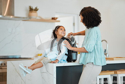 Image of Mother, girl and packing bag for lunch, food and nutrition, wellness and development for morning school. African mom, lunchbox and backpack of child for healthy diet, care and happy in home kitchen