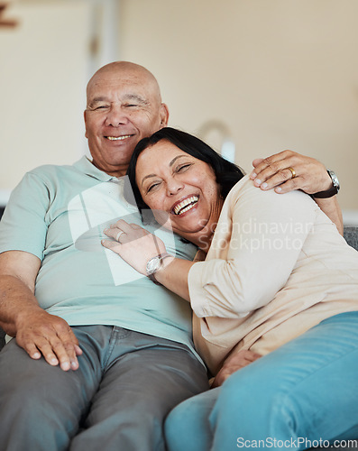 Image of Funny, portrait and senior couple in home living room, bonding and relax together for retirement. Face, laughing and elderly man and woman hug on sofa in lounge, smile and happy in house with love