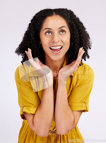 Image of Wow, surprise and hands on face of woman in studio looking up for info, promo or news on white background. Omg, announcement and female with emoji expression to gossip, secret or unexpected wtf drama