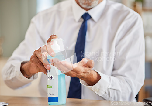 Image of Hands, bottle and sanitizer for business man, cleaning and stop virus for health, wellness or hygiene in office. Professional person, entrepreneur or employee with product, gel or liquid for bacteria