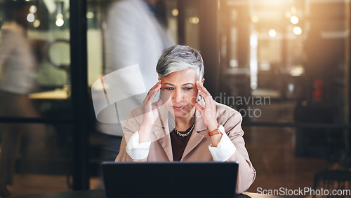 Image of Stress, headache and laptop with business woman in office for fatigue, anxiety and report. Mental health, burnout and frustrated with senior employee and blur for glitch, confused and project problem