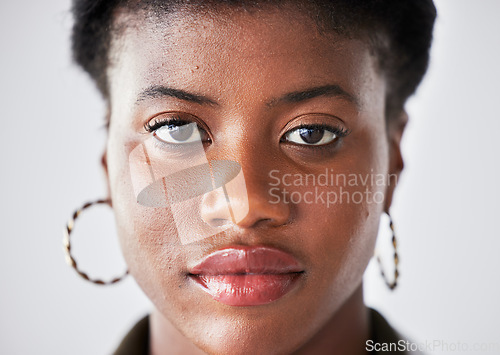 Image of Serious, beauty and face of black woman with confidence on a white background in studio closeup. Student, portrait and African person or calm, female model with cosmetics and style in South Africa