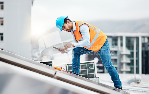 Image of Solar panel, tablet and engineering with man on roof top for renewable energy, project and power. Construction, electricity and sustainability with contractor in city with tools and photovoltaic grid