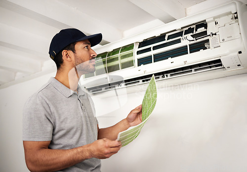 Image of Handyman service, air conditioner technician and man, working on ventilation filter and ac repair. Contractor, maintenance or electric aircon machine expert problem solving or cleaning dust in office