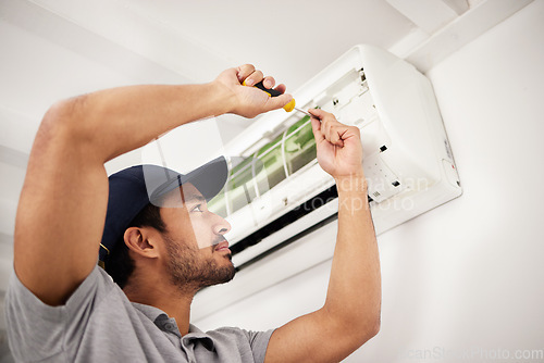 Image of Air conditioner, man and electrical machine repair with person in a home with ac box. Maintenance, screwdriver and system control for installation, inspection of aircon fix in house with contractor